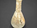a small glass vase that is sitting on a table