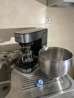 a large metal bowl sitting on top of a kitchen counter