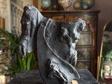 a statue of a horse on a table in a room