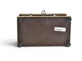 a brown suitcase with a tag on it