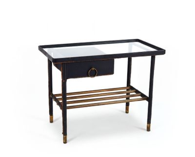 une photo d'une table d'appoint noire et dorée avec un plateau en verre