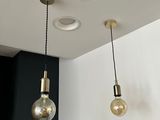 three lights that are hanging from the ceiling in the room