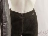 a male mannequin wearing a leather jacket and pants