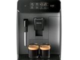 a close up of a coffee machine with two cups of coffee