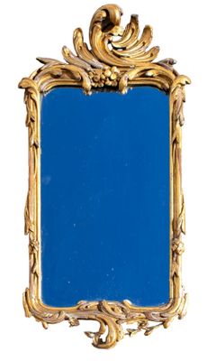 Miroir rocaille en bois sculpté et doré, glace postérieure H…