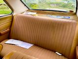 a seat in the back of a car with a paper on it