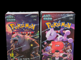 two packs of pokemon trading cards on a black background