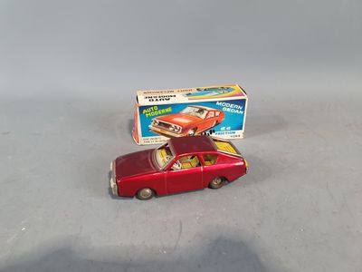 toy car with box on top of it sitting on a table