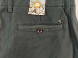 men ' s green pants with a tag on the back of the pants