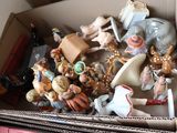a box full of figurines sitting on a table