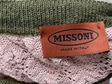 a label that says moscom on a sweater