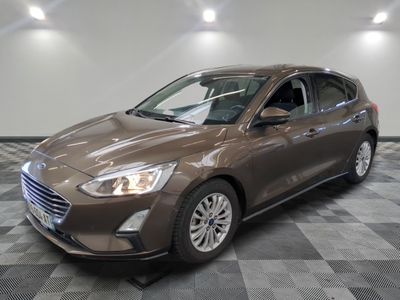 the new ford focus is shown in a showroom with checkered flooring