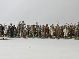 a lot of figurines that are standing in a row