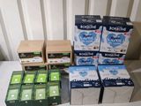 several boxes of soap sitting on top of a table next to each other