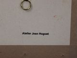 a picture of a gold ring on a piece of paper