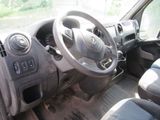 a car dashboard with a steering wheel and dashboard buttons