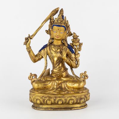 Bouddha Manjushri assis, bronze doré et patiné, 20e siècle.