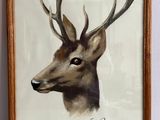 tableau représentant un cerf avec des bois sur la tête, dans un cadre en bois