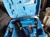 a blue case with tools in it sitting on a table
