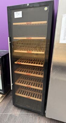 two refrigerators that are next to each other on the floor