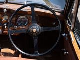 a steering wheel and dashboard of an old car