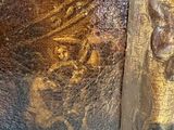 a close up of a painting on the wall of a building