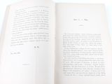 an open book that has a picture of a cat on it