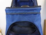 a blue backpack sitting on top of a wooden table