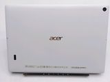 the back of a white laptop computer sitting on top of a white table