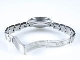 an image of a close up of a wrist watch on a white surface