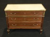 a wooden chest of drawers with brass handles and drawers