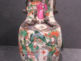 a vase that has a picture of a woman on it