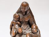 an image of a statue of a woman with two children