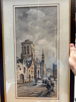 someone is holding a picture of a painting in a frame