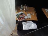 a black suitcase with a white t - shirt in it sitting on a table