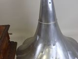 a silver lamp that is next to a wooden box