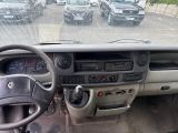 a dashboard of a truck with a lot of cars in the background