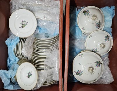 a lot of dishes and cups in a brown box
