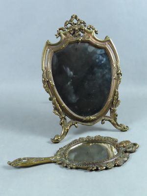 a small mirror and a small mirror on a table