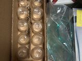 a box full of empty glass jars and a box of empty glass jars