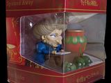 a box with a figurine of a woman in a blue dress