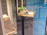 a phone booth with a phone on it in a store window