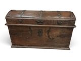an old wooden chest with ornate carvings on the sides