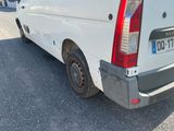 a white van that is parked on the side of the road