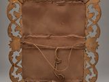 an old picture frame with a brown leather cover and a rope