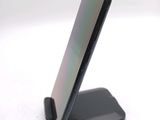 a cell phone that is sitting on top of a stand