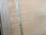 a picture of a piece of wood with writing on it