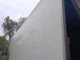 a truck that has a picture of a man on the side of it