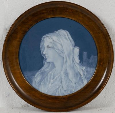 painting of a woman ' s profile in a wooden frame on a wall