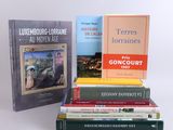 several books are stacked on top of each other on a table